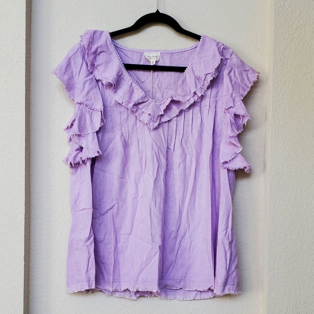 1.4.3 Story by line up NWT purple ruffle top.  Size M